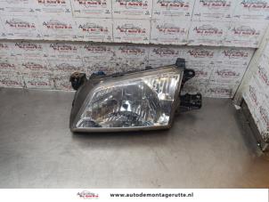 O169878 Gebruikte koplamp links Mazda Demio