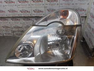 O169942 Gebruikte koplamp links Renault Modus