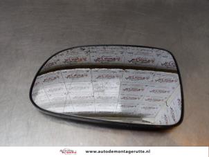 O170258 Gebruikte spiegelglas links Opel Corsa