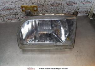 O170577 Gebruikte koplamp links Ford Escort