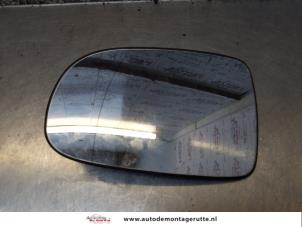 O170938 Gebruikte spiegelglas links Opel Corsa