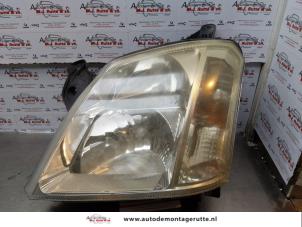 O171811 Gebruikte linker koplamp Opel Meriva