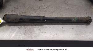 O174099 Gebruikte schokbreker links-achter Mitsubishi Colt