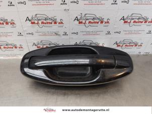 O174255 Gebruikte portiergreep 4deurs links-achter Hyundai Santafe