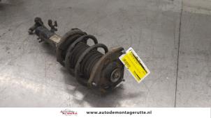 O174338 Gebruikte schokdemperpoot rechts-voor BMW Mini One