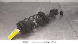 O175454 Gebruikte schokdemperpoot rechts-voor Opel Corsa