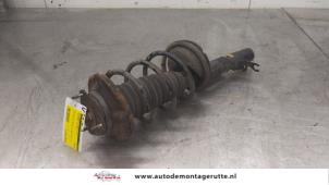 O175455 Gebruikte schokdemperpoot rechts-voor Ford Focus