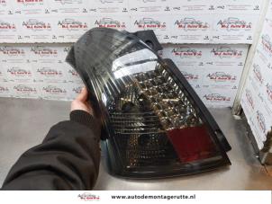 O176057 Gebruikte achterlicht links Suzuki Swift