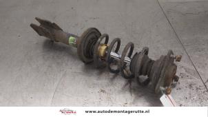 O176496 Gebruikte mac phersonpoot links-voor Mitsubishi Colt