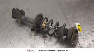 O176497 Gebruikte schokdemperpoot rechts-voor Mitsubishi Colt