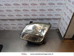 O176539 Gebruikte koplamp links Suzuki Ignis