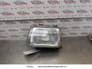 O176567 Gebruikte koplamp links Suzuki Alto