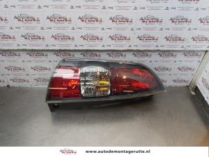 O176672 Gebruikte achterlicht links Subaru Justy