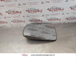 O178811 Gebruikte spiegelglas links Opel Tigra