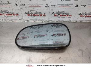 O179340 Gebruikte spiegelglas links Honda Logo