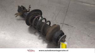 O179387 Gebruikte mac phersonpoot links-voor Dacia Lodgy