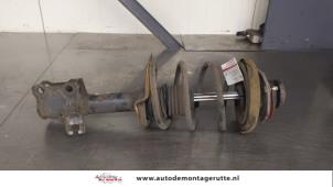 O180648 Gebruikte schokdemperpoot rechts-voor Nissan Almera Tino