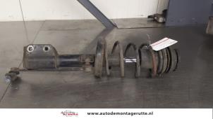 O180655 Gebruikte schokdemperpoot links-voor Opel Astra