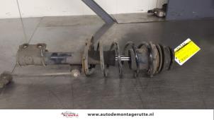 O180673 Gebruikte schokdemperpoot rechts-voor Opel Corsa