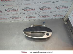 O181355 Gebruikte portiergreep 4deurs links-voor Chevrolet Tacuma
