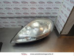 O181987 Gebruikte koplamp links Renault Trafic