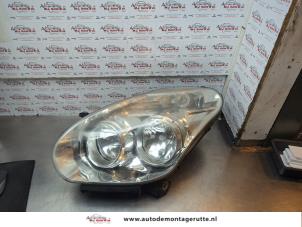 O182172 Gebruikte koplamp links Opel Combo