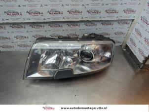 O182344 Gebruikte linker koplamp Skoda Superb