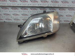 O182599 Gebruikte koplamp links Dacia Logan