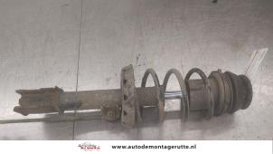 O182683 Gebruikte schokdemperpoot links-voor Opel Astra