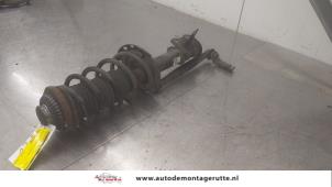 O182809 Gebruikte schokdemperpoot links-voor Opel Astra