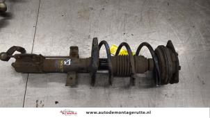 O183507 Gebruikte schokdemperpoot rechts-voor Renault Clio
