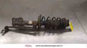 O183651 Gebruikte schokdemperpoot links-voor Opel Astra