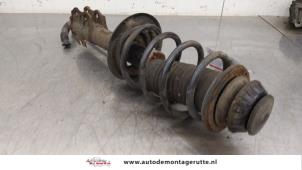 O183870 Gebruikte schokdemperpoot rechts-voor Toyota Yaris