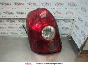 O183919 Gebruikte achterlicht links Mazda 323F