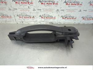 O183957 Gebruikte portiergreep 4deurs links-voor Ford Fiesta