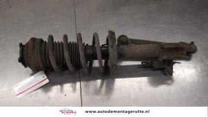 O184333 Gebruikte schokdemperpoot links-voor Opel Astra