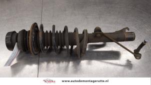 O184335 Gebruikte schokdemperpoot links-voor Ford Fiesta