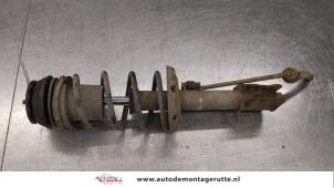 O184372 Gebruikte mac phersonpoot links-voor Opel Corsa