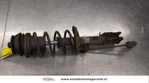 O184373 Gebruikte schokdemperpoot rechts-voor Opel Corsa