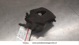 O184470 Gebruikte remklauw (tang) links-voor Volkswagen UP