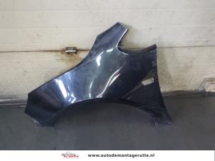 O184670 Gebruikte spatbord links-voor Opel Astra