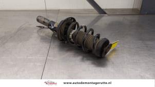O184921 Gebruikte schokdemperpoot rechts-voor Opel Astra