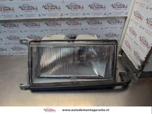 O185030 Gebruikte koplamp links Volvo 4-Serie