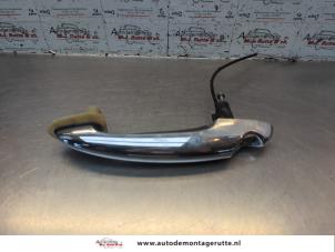 O185608 Gebruikte portiergreep 2deurs links Mini ONE