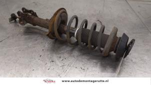 O186038 Gebruikte schokdemperpoot links-voor Suzuki Swift