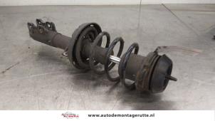 O186046 Gebruikte schokdemperpoot links-voor Opel Astra