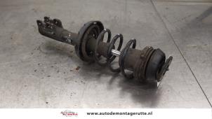 O186047 Gebruikte schokdemperpoot rechts-voor Opel Astra
