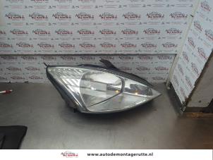 O186085 Gebruikte rechter koplamp Ford Focus