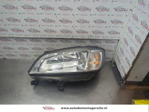 O186828 Gebruikte koplamp links Opel Zafira