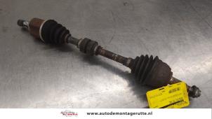 O187257 Gebruikte homokineetas links-voor Nissan Note